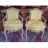 FAUTEUILS, a pair, early 20th century French Louis XV style giltwood and painted,