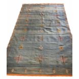 MORROCAN KILIM RUG, 252cm x 146cm, of multiple embroidered emblems, on aquamarine field.