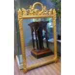 WALL MIRROR, Empire style, with a decorative gilt frame and wreath crest, 83cm W x 138cm H.