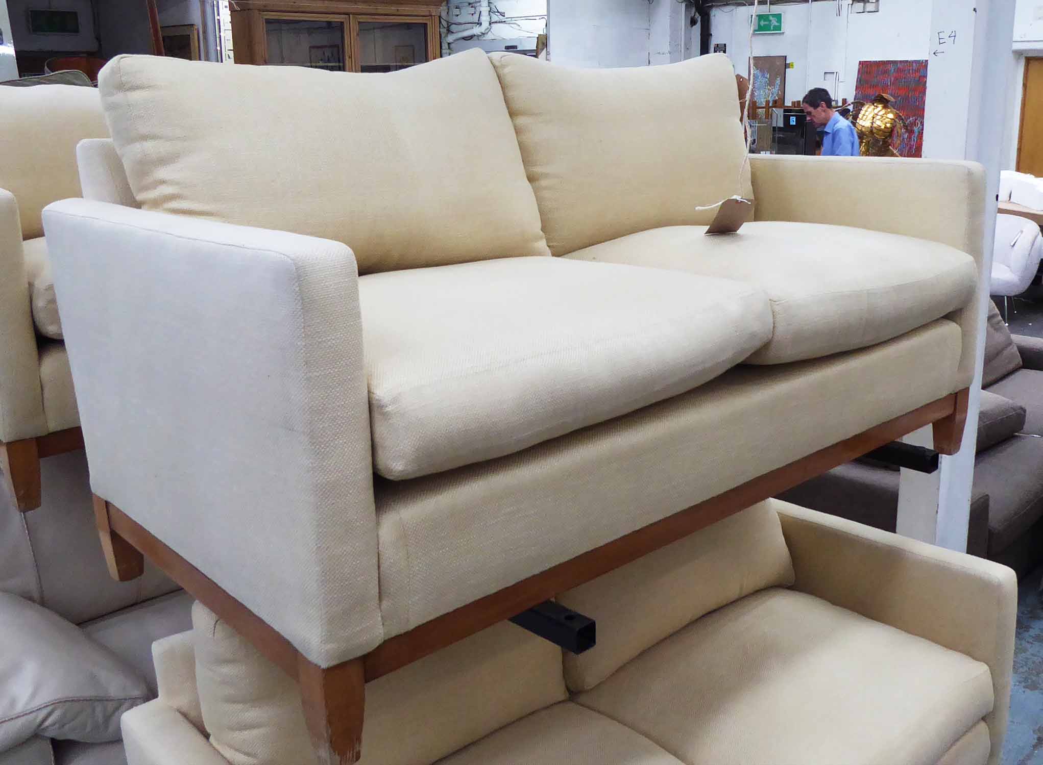 PETER DUDGEON SOFA, 2½ seater, in cream fabric, 92cm D x 170cm W x 96cm H (with faults).