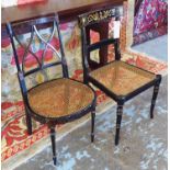 SIDE CHAIRS, two, Regency style black and gilt of differing designs with caned seats.