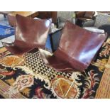 EASY CHAIRS, a pair, metal framed and brown leather, 76cm W x 91cm H.