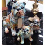 PAINT SPLATTERED BULLDOGS, a family of three, stylised finish, 45cm tallest.