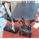 CONTEMPORARY SCHOOL, two football related studies, on marble platforms, 36cm highest.