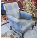 ARMCHAIR, in a blue checked woolen plaid, on turned supports and castors, 75cm.