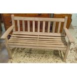 GARDEN TABLE AND BENCH, weathered rectangular slatted teak together with a bench by Lister,