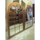 MIRRORS, a pair, Architectural style copper effect, each with an arched top, 118cm W x 181cm H.