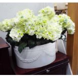 FAUX HYDRANGEAS, in a white, ovid, swag decorated ceramic jardinière, 55cm W.