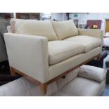 PETER DUDGEON SOFA, 2½ seater, in cream fabric, 92cm D x 170cm W x 96cm H (with faults).