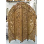 SCREEN, Indian teak, of four arched and foliate carved panels, on castors,