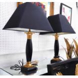 TABLE LAMPS, a pair, black columns with gilt mounts, each 70cm H, including shades,