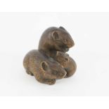 A FINE JAPANESE BOXWOOD NETSUKE OF THREE RATS, finely carved with inlaid eyes, signed.