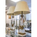 SIDE LAMPS, a pair, cut glass columns with gilt mounts on marble bases,