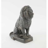 A PATINATED BRONZE MODEL OF A SEATED LION, 19cm H.