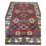 FINE KAZAK RUG, 228cm x 162cm, of multiple medallions, on ivory field.