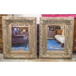 WALL MIRRORS, a pair, Italian style broad silvered foliate frame and bevelled plates, 122cm x 95cm.