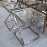 SIDE TABLES, a pair, the glass top on polished metal X frame bases, 51cm W x 51cm D x 64cm H,