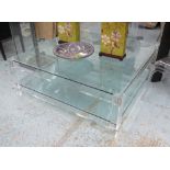 LOW TABLE, glass top and under shelf, on square Perspex supports, 124cm sq. x 45cm H.