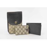 GUCCI MONOGRAM PHONE/CIGARETTE HOLDER, dark leather trims and flap snap closure with iconic GG logo,