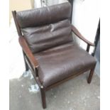 OPEN ARMCHAIR, brown leather on circular wooden supports, 70cm W.