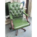 OPEN OFFICE ARMCHAIR, in green button back leather on wooden swivel supports, 59cm W.