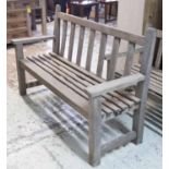 GARDEN BENCH, weathered teak of substantial slatted construction by Pamal, Melton Mowbray,