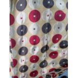 CURTAIN, in a geometric circled fabric lined gathered, 420cm x 228cm drop.