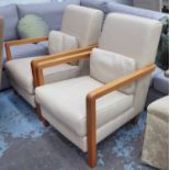 OPEN ARMCHAIRS, a pair, in faux cream leather, on square supports.