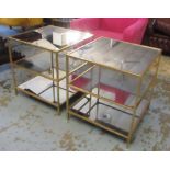 LOW OCCASIONAL TABLES, a pair, gilt metal framed, three tier, each with a mirrored top,