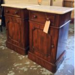 BEDSIDE CABINETS, a pair of Victorian mahogany each with drawers and arched panelled cupboard door,