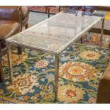 LOW TABLE, 1970's rectangular polished glass and square section silvered metal frame,