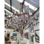 CHANDELIER, two tiers each with eight sconces, the metal frames with cut glass droplets,