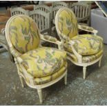 FAUTEUILS, a pair, Louis XV style in silk Ikat fabric on a cream painted frame, 67cm W.