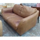 SOFA, two seater, in tanned leather on block supports, 178cm L.
