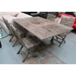 GARDEN TABLE, weathered teak extending with a rectangular top and a folding leaf,