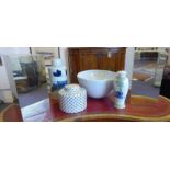 COLLECTION OF PORCELAIN, including jars, a large bowl and mirrored plinths.
