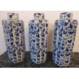 ORIENTAL VASES, a set of three, hexagonal form with lids and decorated with butterflies.