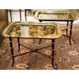 TRAY TABLES, a pair, Regency style gilt and black lacquered on X stretcher faux bamboo supports,