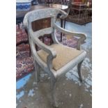 INDIAN SILVER ARMCHAIR, carved and silvered metal with rams head motif back and drop in seat,