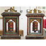 PRAYER WHEELS, a pair, Tibetan polychrome painted with central rotating cylinders,