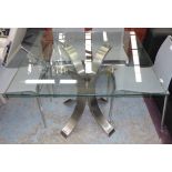 OSVALDO BORSANI INSPIRED DINING TABLE, square glass top on splay polished steel splay supports,