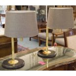 DESK LAMPS, a pair, 1980's gilt metal each with adjustable arm and circular black bases, 54cm H.