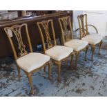 DINING CHAIRS, a set of four, Edwardian with pierced splat backs on claw and ball supports,