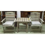 GARDEN ARMCHAIRS, a pair, silvery weathered teak slatted and stacking together with a low table,