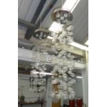 UNITED LIGHTS CHANDELIERS, a pair, 110cm Drop.