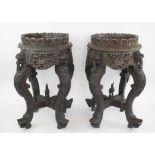 BURMESE CARVED ROSEWOOD JARDINIERE STANDS, a pair, 19th century, 32cm x 54cm H.