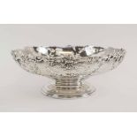 A SILVER PIERCED FOOT BOWL, with grape vine decoration.