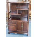 SIDE CABINET, Chinese padouk with open shelves above three drawers and two doors,