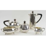 A FINE ARTS & CRAFTS PLANISHED SILVER TEA AND COFFEE SET BY CHARLES EDWARDS,