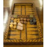 A GERMAN ROSEWOOD AND YEWWOOD GAMES BOARD, early 18th century with chevron borders the inside,